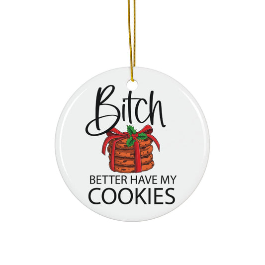 Round ceramic ornament with text and a stack of cookies design, hanging on a gold string.