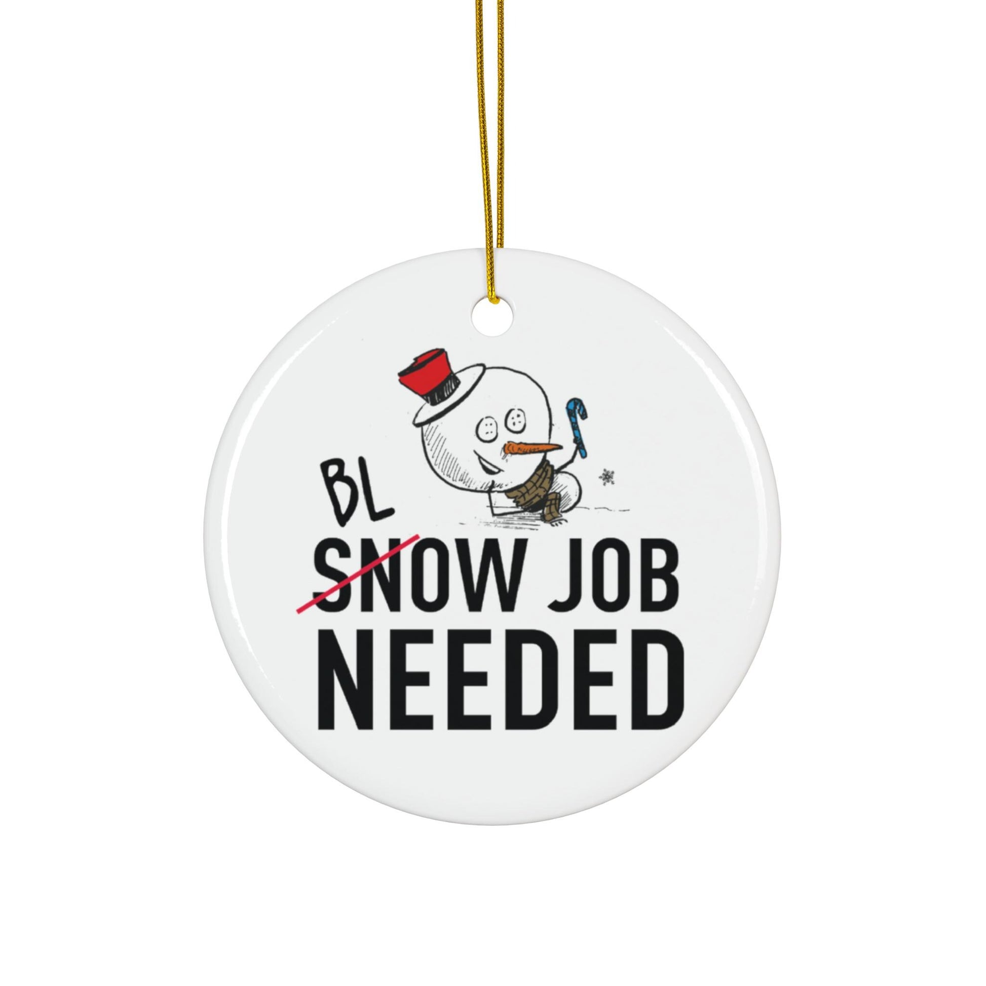 Round ceramic ornament with a snowman design and text on a white background