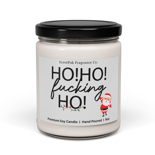 Candle with a humorous label featuring the text 'HO! HO! fucking HO!' on a white background.