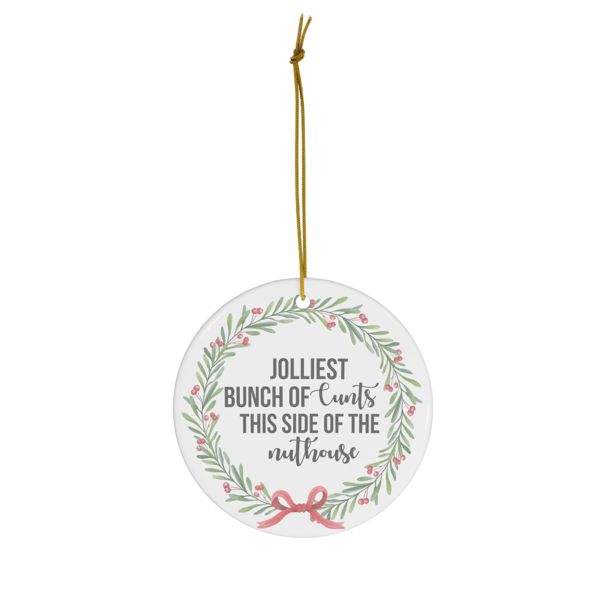 Round decorative ornament with text and floral design on a white background