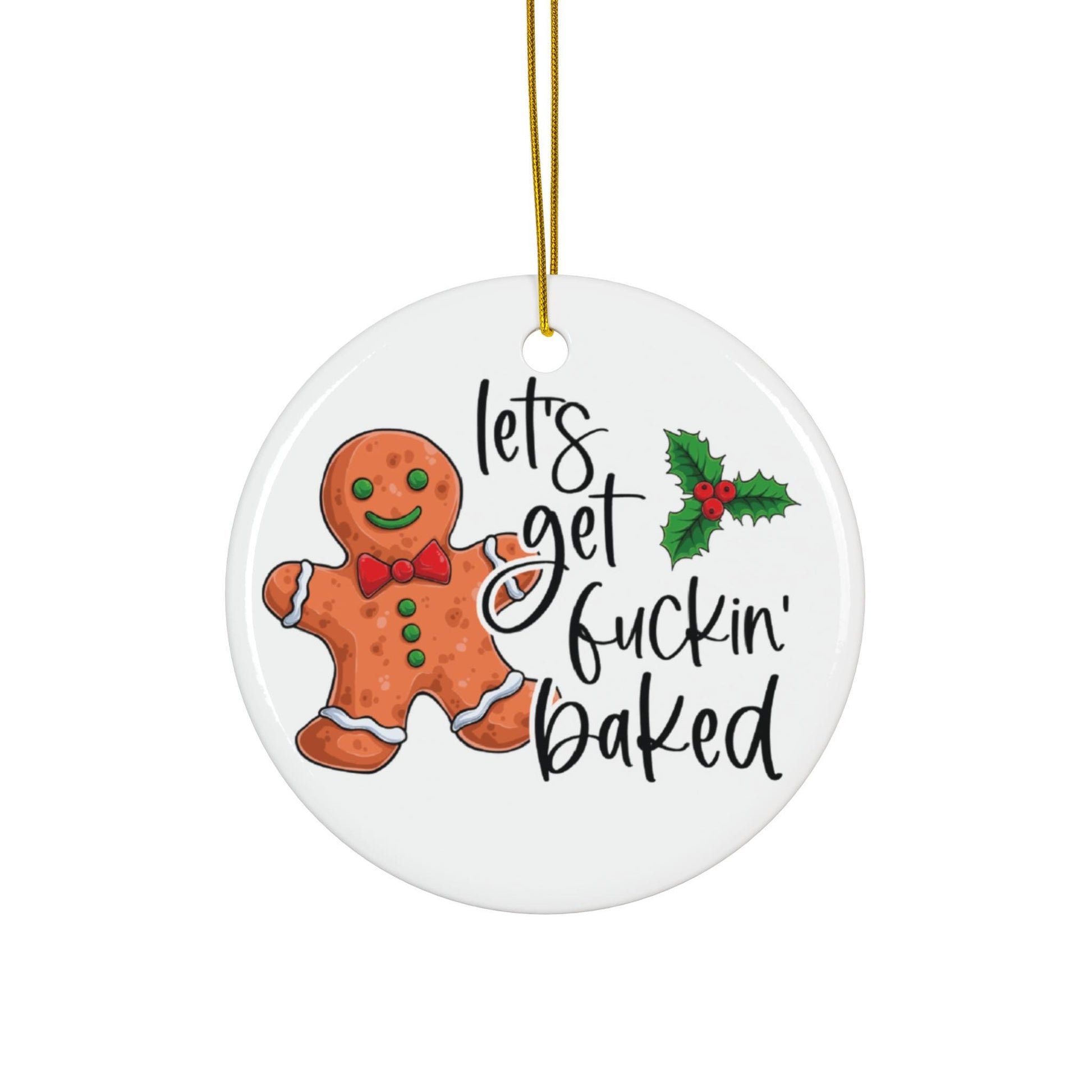 Round ceramic ornament with a gingerbread man and holly leaf, featuring the text 'Let's get f***in' baked'.
