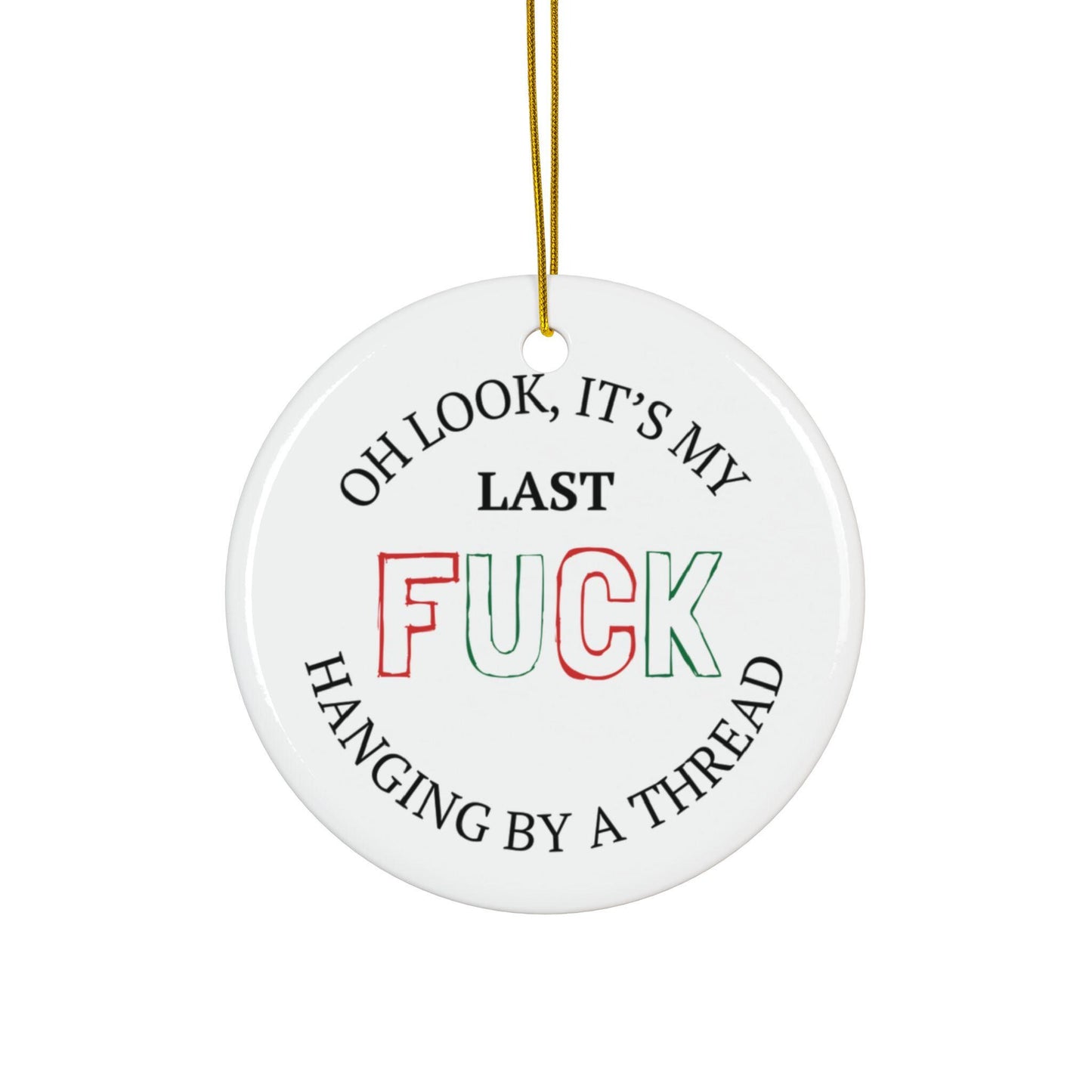 Round white ceramic ornament with humorous text design on a white background