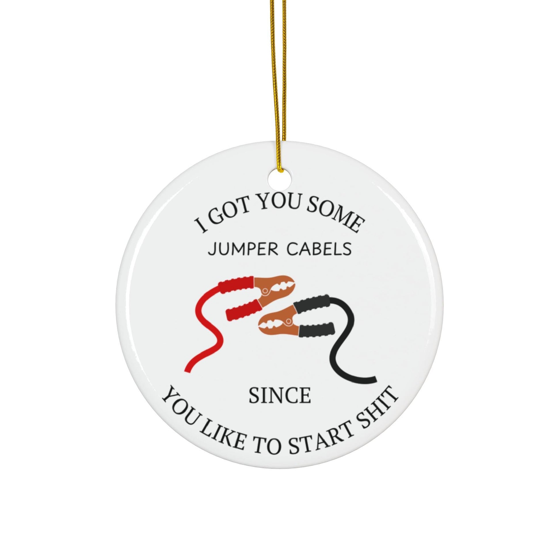 Round white ceramic ornament with jumper cables graphic and text on a white background